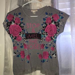 I’m selling a large grey shirt with roses from the brand, Self Esteem